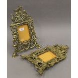 A pair of Victorian brass picture frames. 36 cm high.