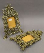 A pair of Victorian brass picture frames. 36 cm high.