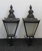 Two painted copper lamp tops by D W Windsor. Approximately 110 cm high.