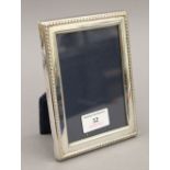 A silver photograph frame, hallmarked for London 1996. 11.75 x 15.5 cm.