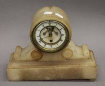 A Victorian alabaster mantle clock. 22.5 cm high.