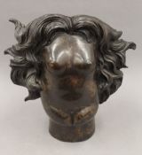 After RENE MAGRITTE (1898-1967) Belgium, The Rape, a patinated bronze. 37 cm high.