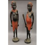 A pair of carved wooden figures of Maasai Tribe people. Each 90 cm high.