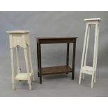 An early 20th century oak side table and two white painted plant stands. The former 59.5 cm long.