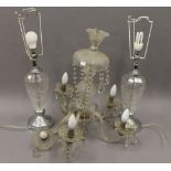 A cut glass chandelier and a pair of table lamps. The former 53 cm high.