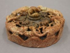 A Chinese soapstone inkwell. 15 cm diameter.