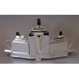 A silver plated Christopher Dresser style tea set. 22 cm high.