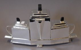 A silver plated Christopher Dresser style tea set. 22 cm high.