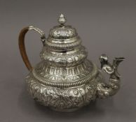 An embossed Dutch silver teapot. 16.5 cm high. 18.2 troy ounces total weight.