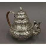 An embossed Dutch silver teapot. 16.5 cm high. 18.2 troy ounces total weight.