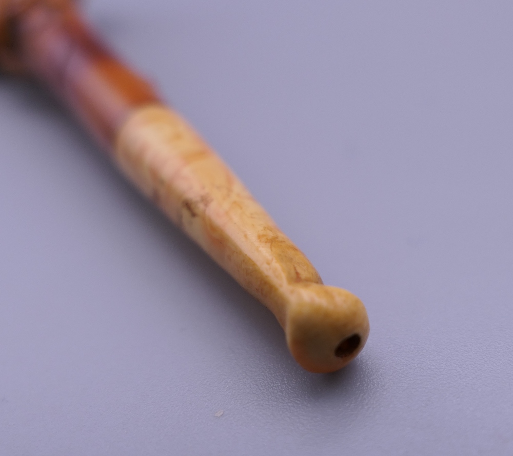 A cased 19th century meerschaum and amber pipe formed as a hand holding a pistol. 12 cm long. - Image 10 of 13