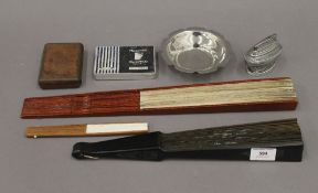 A quantity of miscellaneous items, including fans. The largest 45.5 cm long.