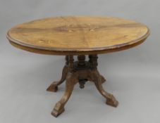 A Victorian inlaid loo table. 120 cm long.