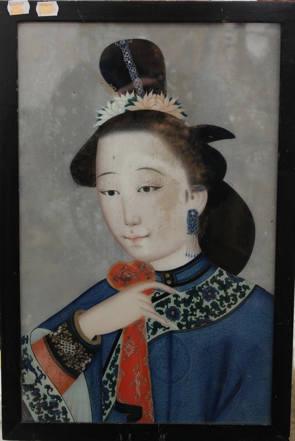 A 19th century Chinese reverse glass painting of a female beauty, framed and glazed. 35.