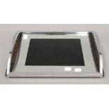 An Art Deco chrome framed glass tray. 37 cm wide.