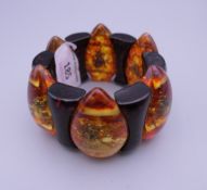 An amber style bug bracelet. Approximately 20 cm long.