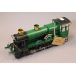 A green painted model of a locomotive. 30 cm long.