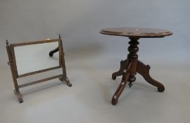 A Victorian mahogany toilet mirror and a small tripod table. The former 39.5 cm wide.