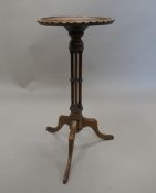 An early 20th century mahogany wine table. 56 cm high.