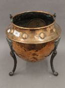 An Arts and Crafts copper coal bucket. 31 cm high excluding handle.