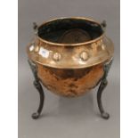 An Arts and Crafts copper coal bucket. 31 cm high excluding handle.