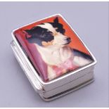 A silver pill box decorated with a chihuahua. 3.25 cm high.