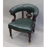 A leather upholstered Victorian oak tub chair. 71 cm wide.