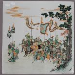 A Chinese famille verte porcelain plaque depicting warriors before battle. 40.5 cm wide.