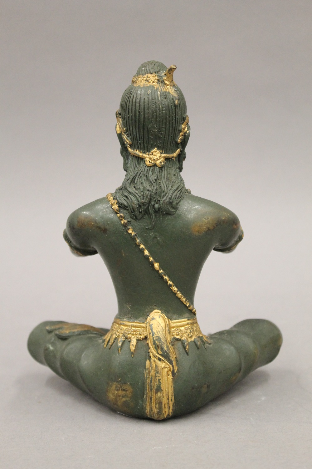 A bronze model of Buddha playing a flute. 18.5 cm high. - Image 4 of 5