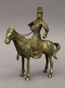 A brass model of a Mongolian warrior on horseback. 22.5 cm high.