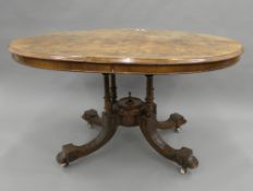 A Victorian walnut loo table. 131 cm long.