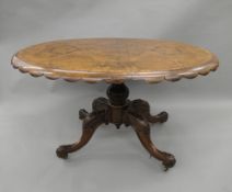 A Victorian burr walnut loo table. 130 cm long.