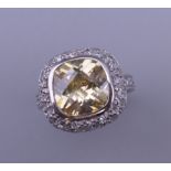 A silver, yellow and white cubic zirconia ring. Ring size L/M.