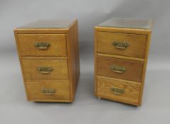 A pair of early 20th century oak bedside drawers. 59 cm high, 35 cm wide, 45.5 cm deep.