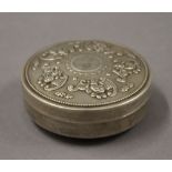 A Chinese round box. 8 cm diameter.