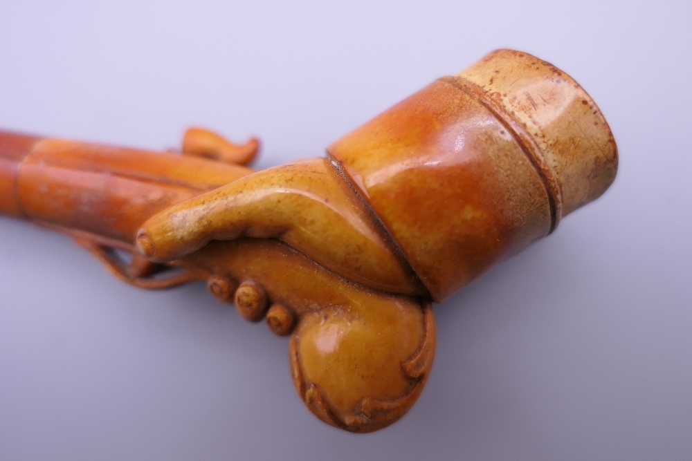 A cased 19th century meerschaum and amber pipe formed as a hand holding a pistol. 12 cm long. - Image 5 of 13