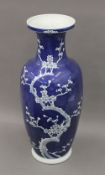 A large Chinese blue and white prunus blossom porcelain vase. 64 cm high.