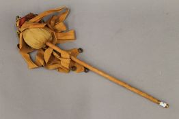 A vintage jesters stick with bell. 67 cm long.