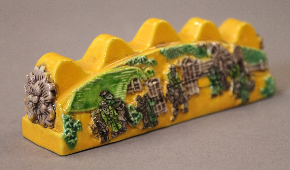 A Chinese yellow porcelain brush rest. 12.5 cm long. - Image 4 of 4