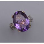 A 9 ct gold, amethyst and diamond ring. Ring size L/M.
