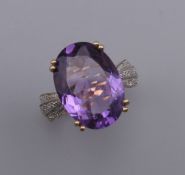 A 9 ct gold, amethyst and diamond ring. Ring size L/M.