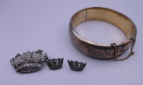 A silver marcasite brooch and earrings en-suite, together with a silver bracelet. The latter 6.