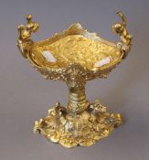A gilt bronze cherub centrepiece. 21 cm high.