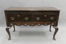 An 18th century and later oak dresser base. 122 cm wide.