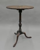 A 19th century mahogany tilt top tripod table. 48 cm diameter.