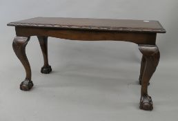 A mahogany coffee table. 91 cm long.