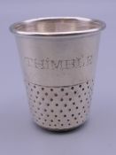 A 925 silver spirit measure in the form of a thimble. 5 cm high.