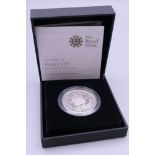 A boxed silver proof 5 pound coin