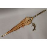 A Meiji Period parasol with gilt metal decorated handle. 86.5 cm long.