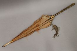 A Meiji Period parasol with gilt metal decorated handle. 86.5 cm long.